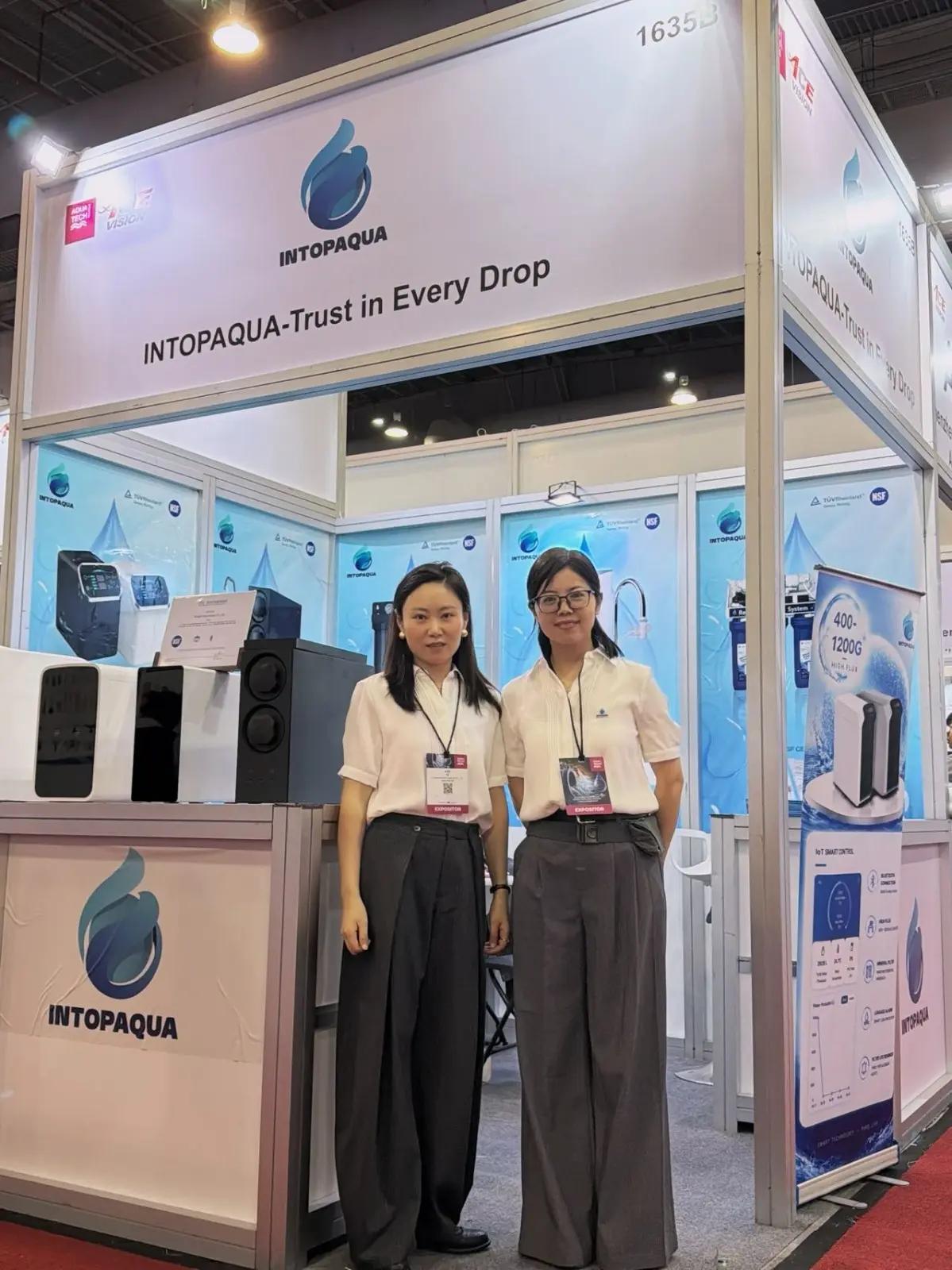 INTOP team members welcoming visitors at the Aquatech Mexico booth